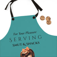 A teal kitchen apron with black neck and waist straps, featuring the text 'For Your Pleasure SERVING SMUT & SNACKS' and a small vintage-style illustration of a woman with a pink bow at the bottom. Three chocolate chip cookies are placed to the right on a white background.