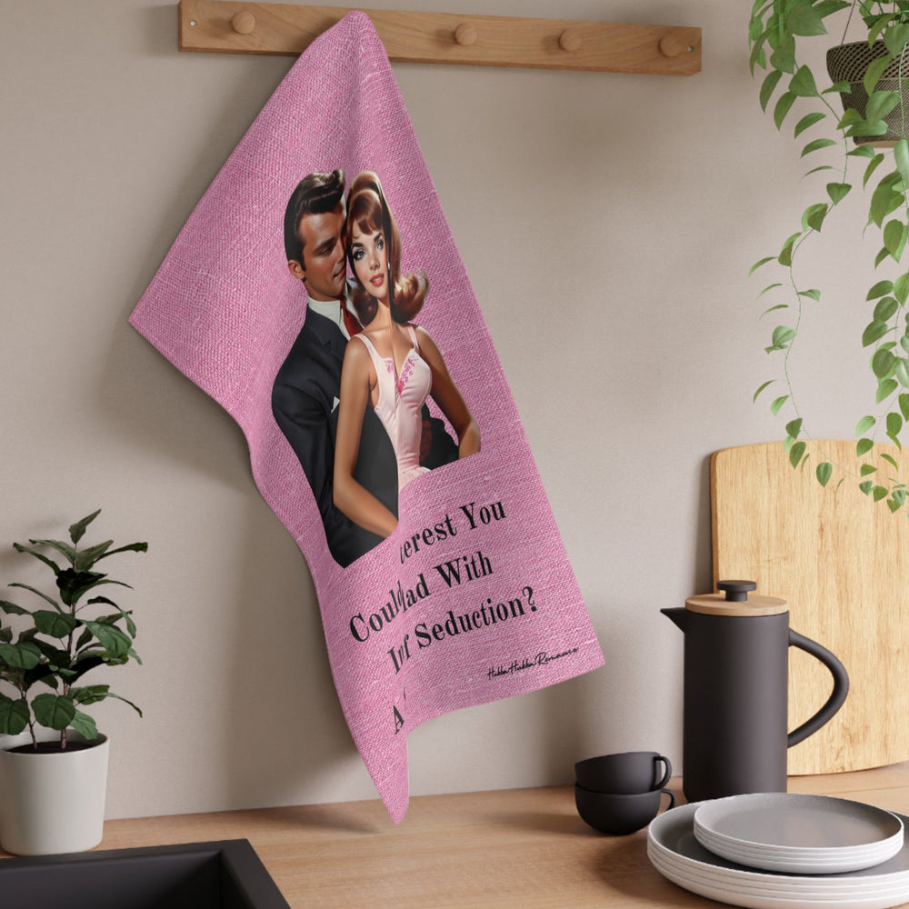 The towel is displayed on a wall hook in a kitchen setting.

