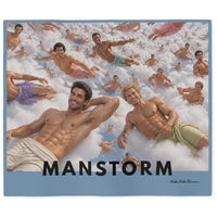A sweatshirt blanket featuring a collage of exaggeratedly good looking  shirtless men floating on clouds, with the large text 'MANSTORM' across the bottom and a light blue border. Meant to be tongue in cheek. 