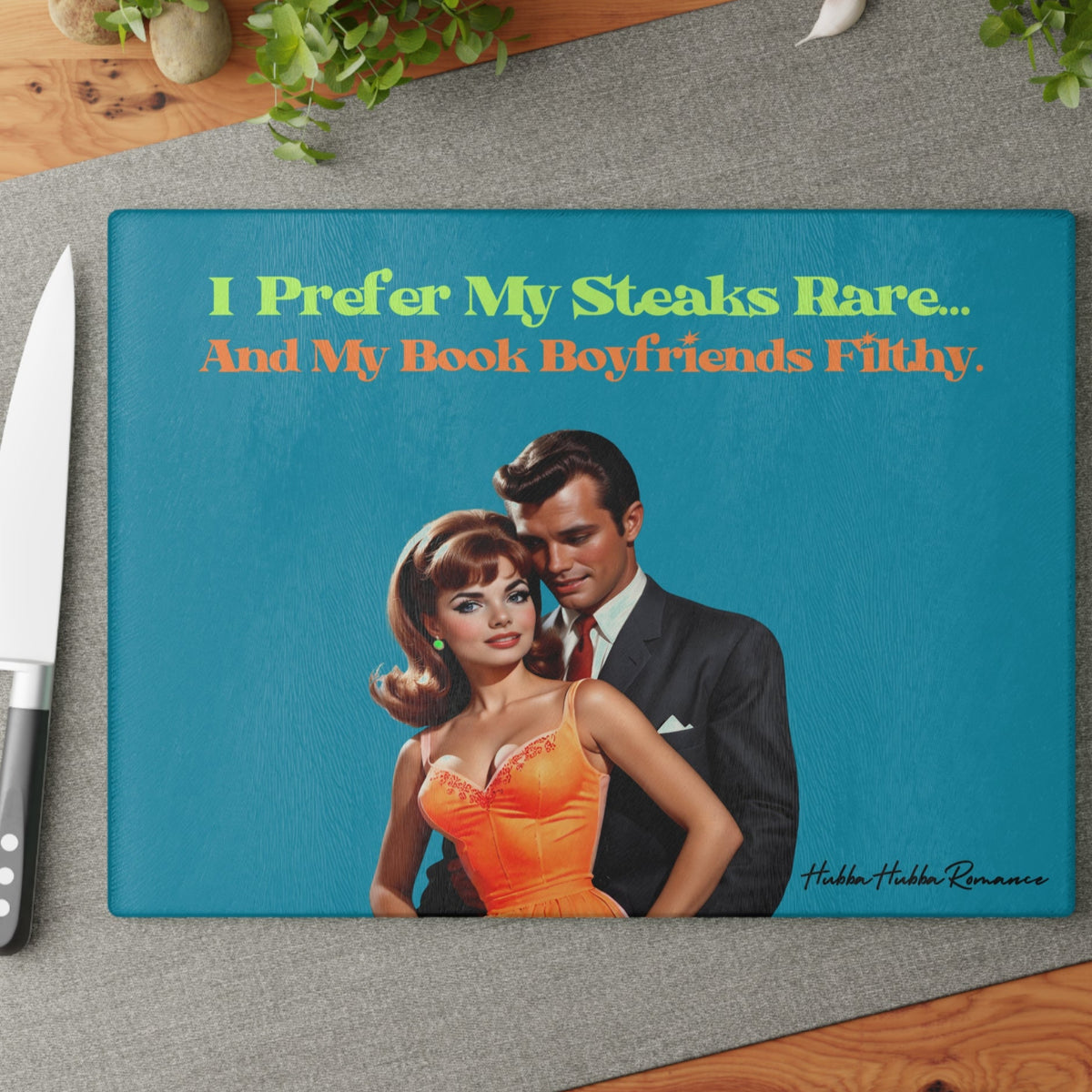This image shows the cutting board displayed on the table with a knife placed beside it in anticipation of using the board to cut something.