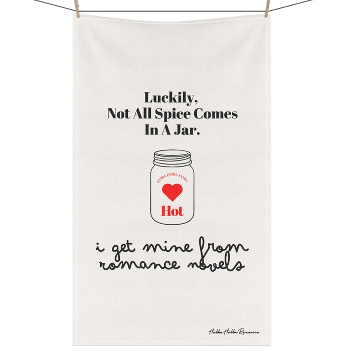 Towel with mason jar graphic and red heart. Text reads: “Luckily, not all spice comes in a jar. Think Romance Novels.”