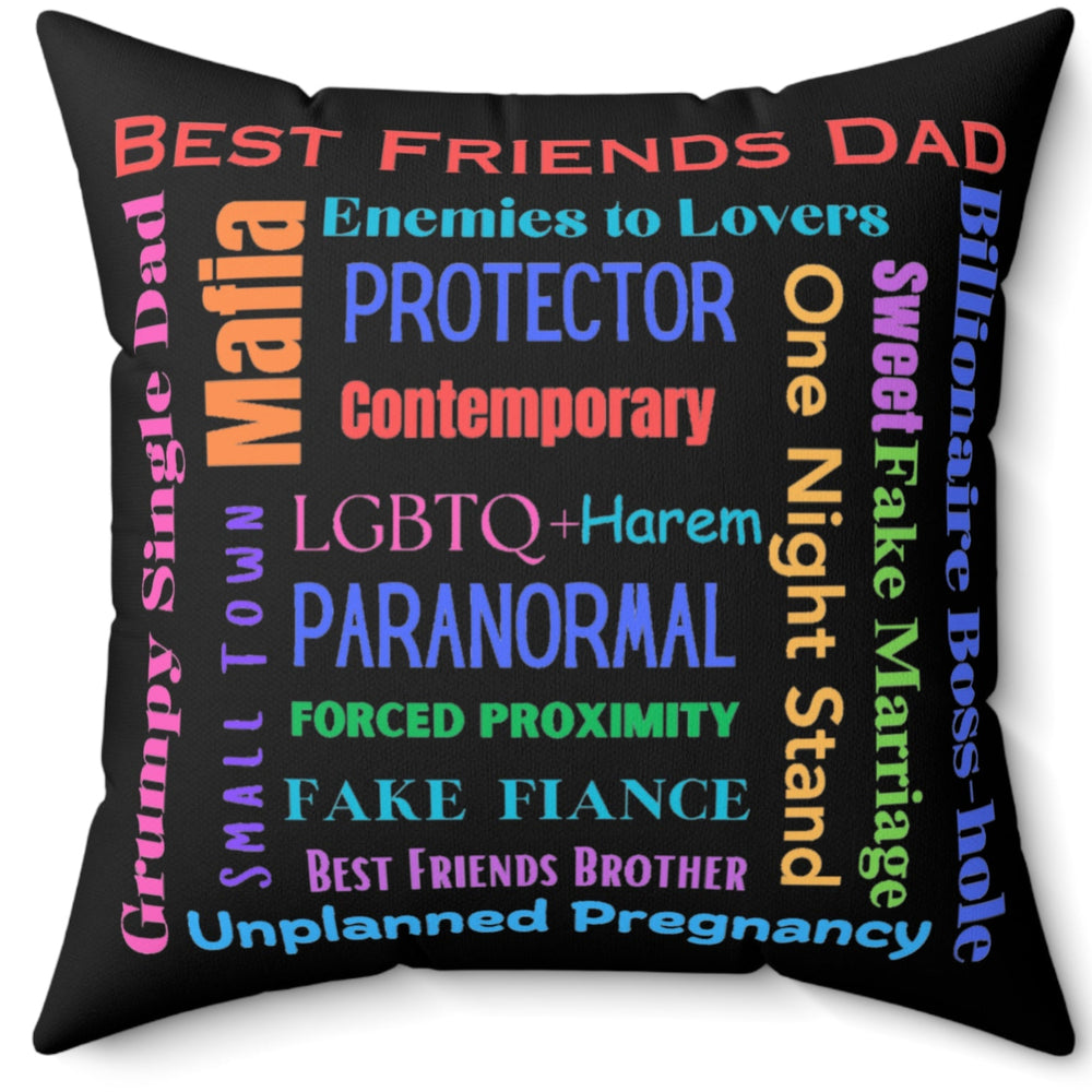 Square pillow with black background, colorful word cloud of romance tropes, including “Best Friend’s Dad,” “Enemies to Lovers,” “Grumpy Single Dad,” “Paranormal,” and “Billionaire Boss-hole.”