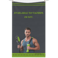 The image shows a kitchen towel with a grey background and a vintage-style illustration of a smiling man in a muscle shirt using a vacuum cleaner. He wears jeans and has a confident, playful expression. Lime green bold text reads: "Available To Vacuum. Or Not." The design combines retro charm with cheeky humor, making it a fun and sassy accessory for romance readers who appreciate a little double entendre with their cleaning vibes. The kitchen towel is displayed on a clothesline.
