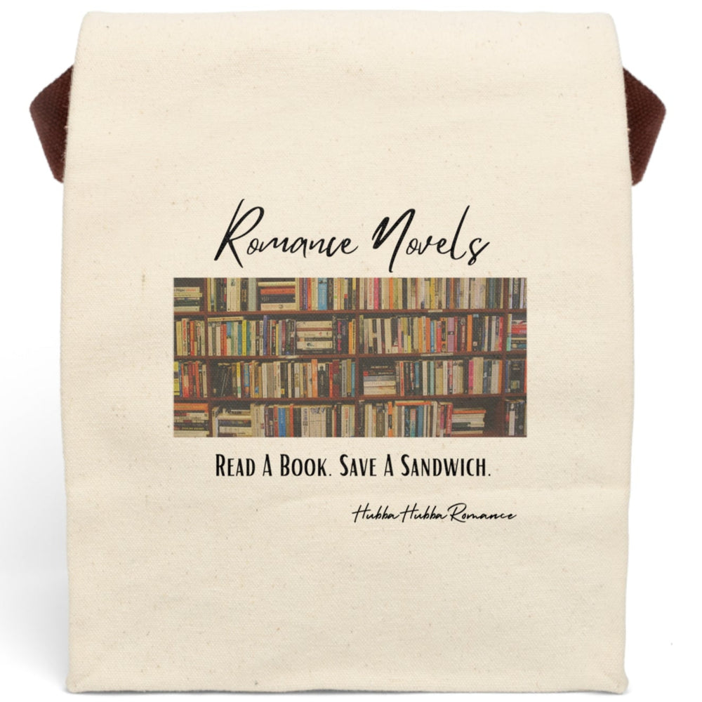 This canvas lunch bag features a full-color image of wooden bookshelves filled with dozens of romance novels and paperbacks in a library-style setting. Above the image, the words “Romance Novels” are written in a flowing black script. Below the bookshelves, bold black lettering reads: “Read A Book. Save A Sandwich.” The bag has a roll-top closure and a sturdy canvas carrying strap.