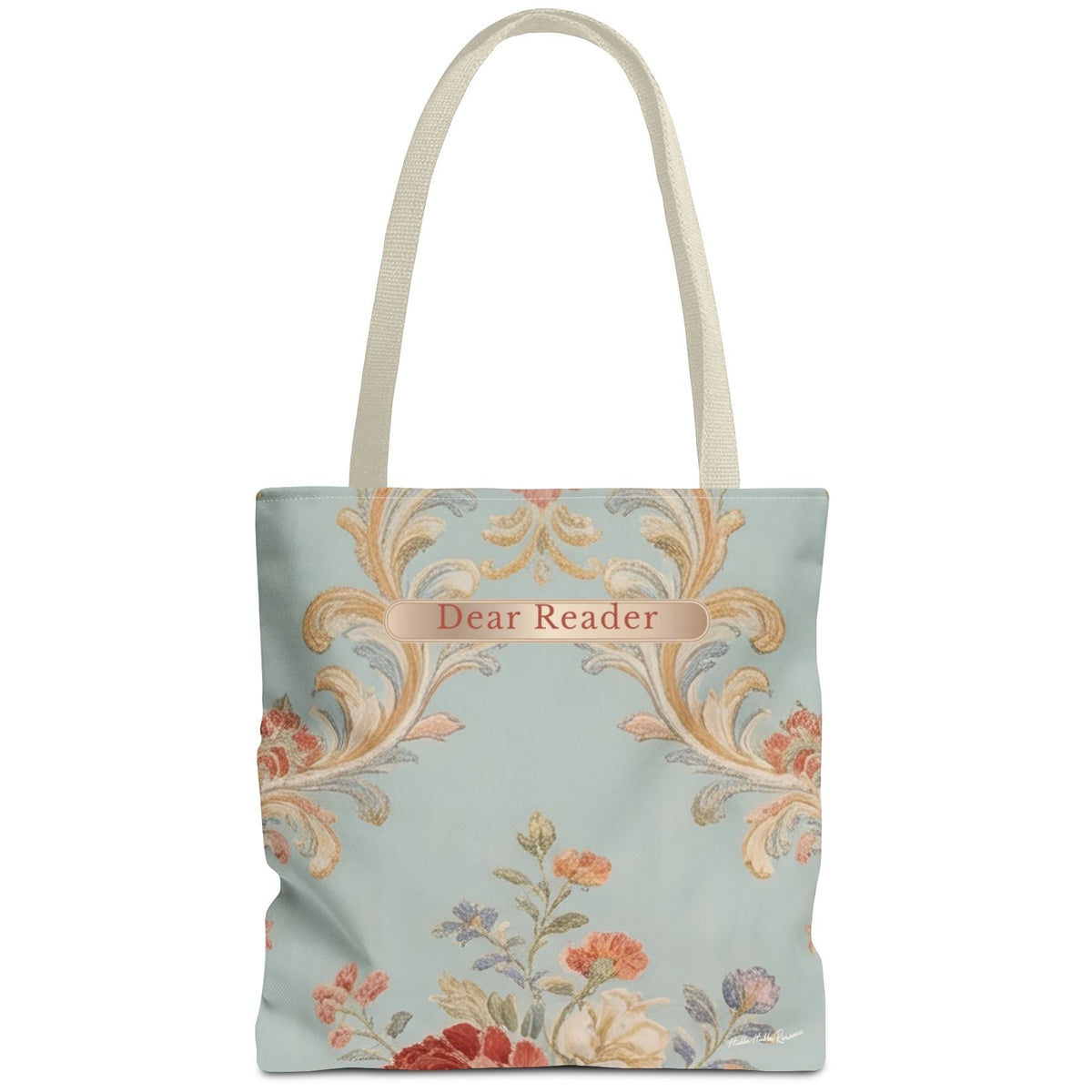 A canvas tote bag with a light blue background, featuring a vintage-style damask pattern in gold, orange, and pink, with a floral motif at the bottom. The text 'Dear Reader' is printed in a decorative font on a gold banner across the upper center.
