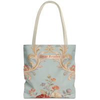 A canvas tote bag with a light blue background, featuring a vintage-style damask pattern in gold, orange, and pink, with a floral motif at the bottom. The text 'Dear Reader' is printed in a decorative font on a gold banner across the upper center.