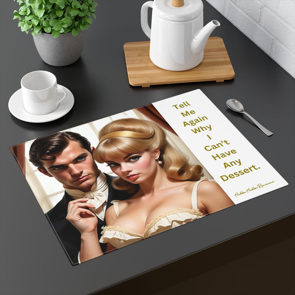 The placemat is displayed on a table with a cup and saucer, a teapot, a plant, and a spoon for context.

