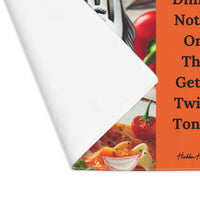 The placemat is folded over at the left corner to show the white cotton backing.
