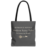 Gray tote bag with cream font that says Romance Novels. Modern Fairy Tales for Gown Ass Women. Unerneath the stacked text is a large ornate key to a castle.