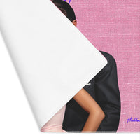 The placemat is folded over at the left corner to show the white cotton backing.