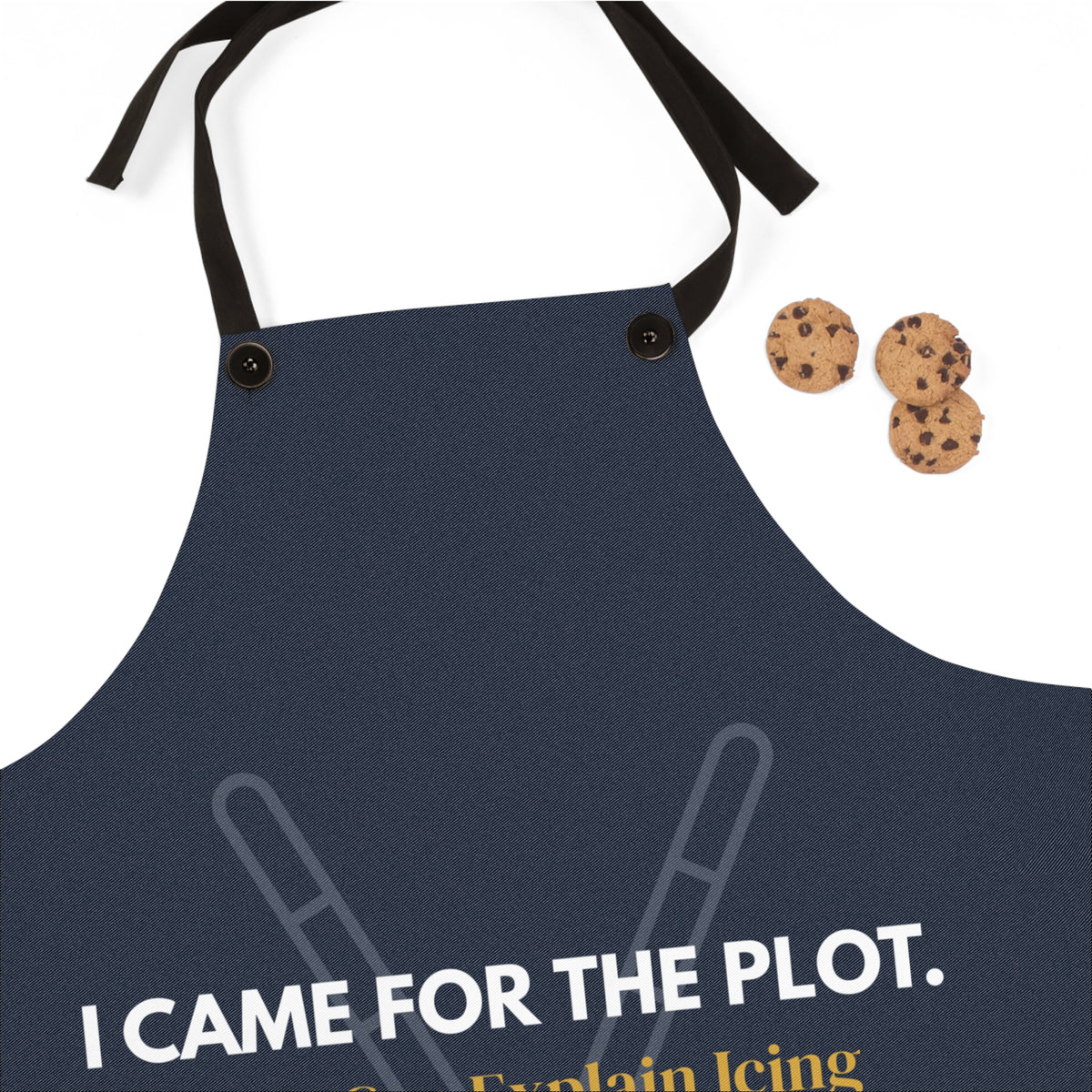 A navy blue kitchen apron with black neck and waist straps, featuring the white printed text 'I CAME FOR THE PLOT.' 