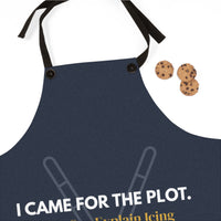 A navy blue kitchen apron with black neck and waist straps, featuring the white printed text 'I CAME FOR THE PLOT.' 