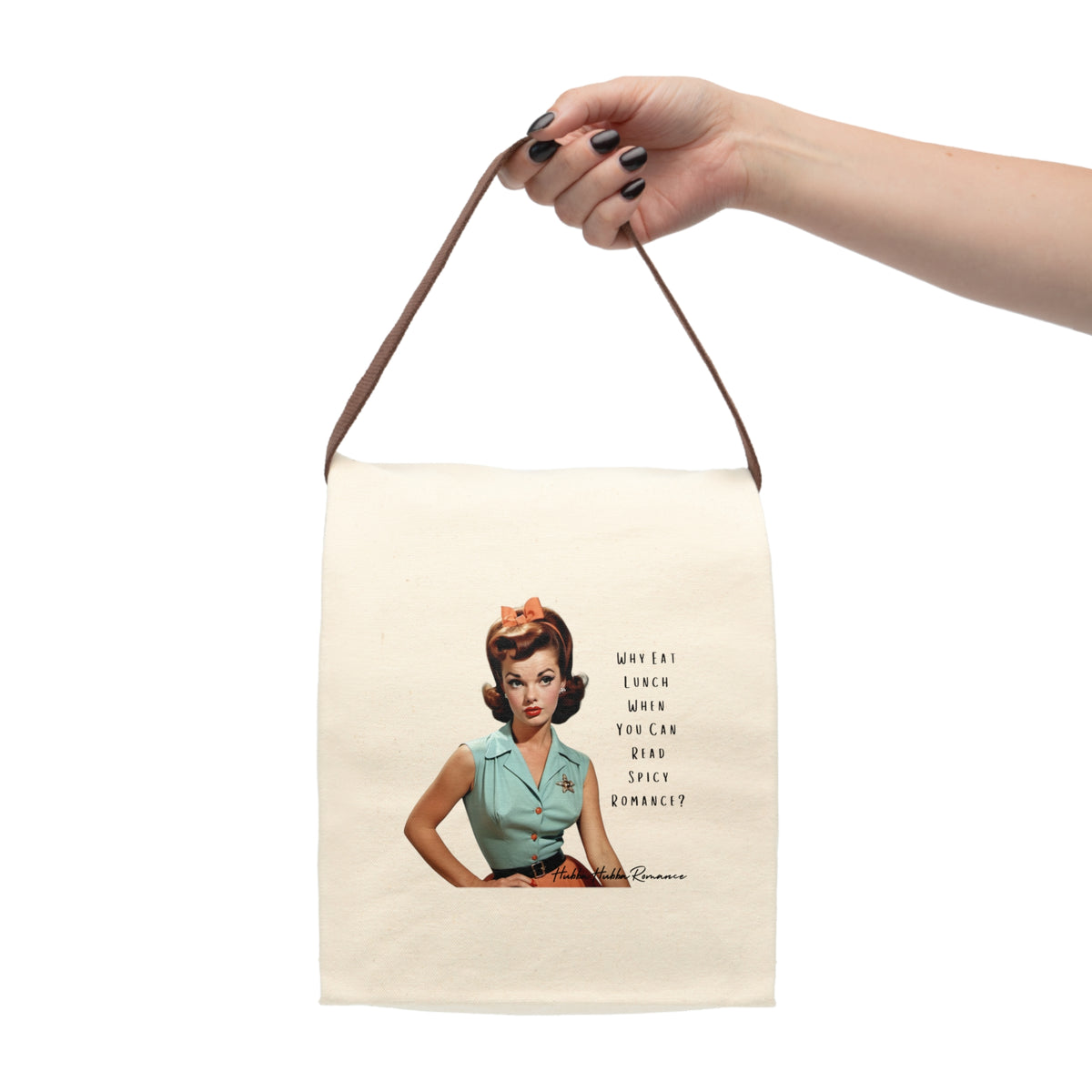 Hand holding canvas lunch bag with a retro 1950s woman in mint blouse and bow, paired with text: “Why eat lunch when you can read spicy romance?”