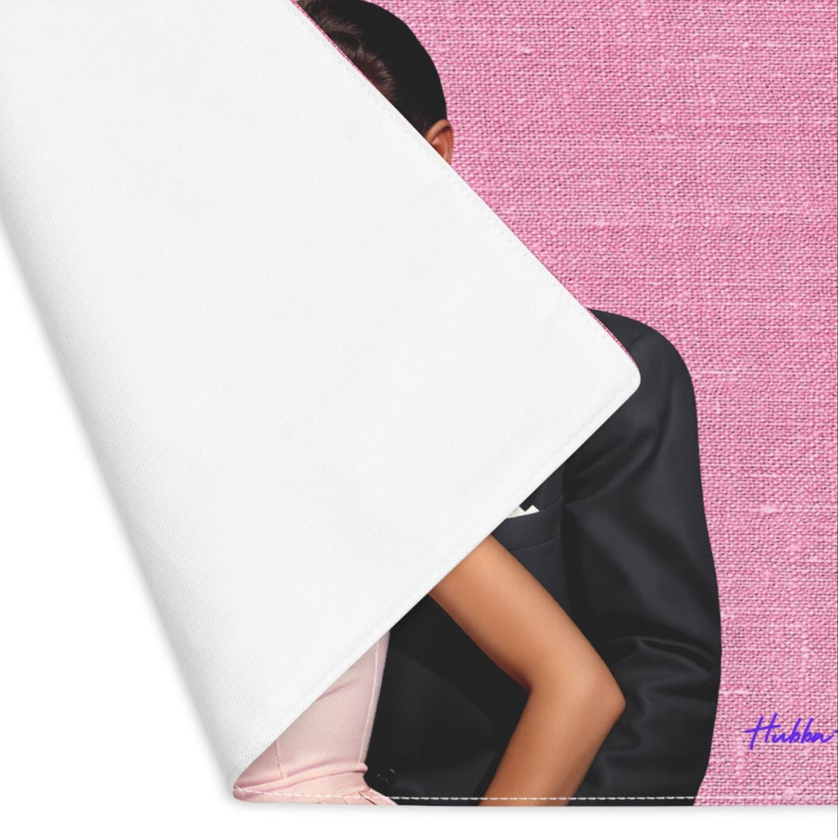 The placemat is folded over at the left corner to show the white cotton backing.
