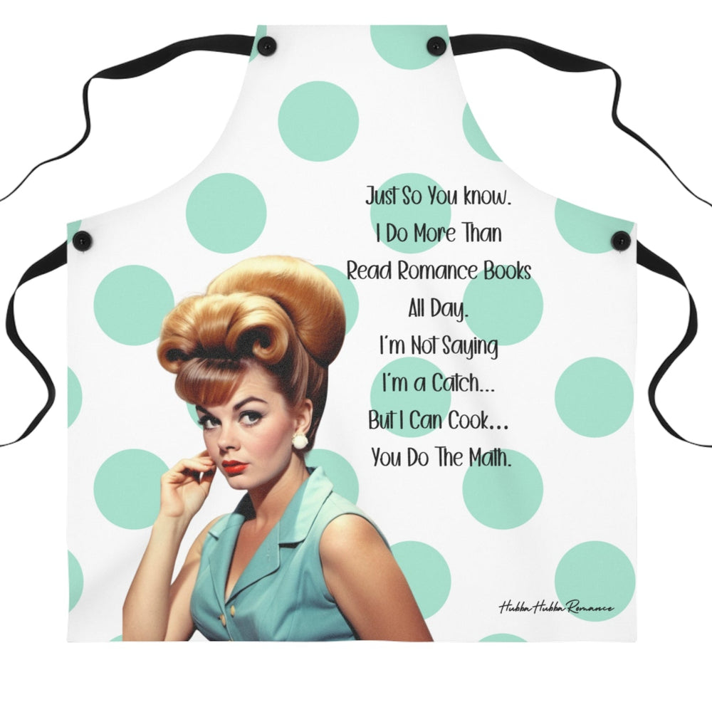 A white apron with large mint-green polka dots and black straps features a retro-style illustration of a glamorous 1960s woman with red hair styled in an updo, wearing a teal dress and pearl earrings. The text reads: "Just so you know, I do more than read romance books all day. I'm not saying I'm a catch... but I can cook... you do the math."

