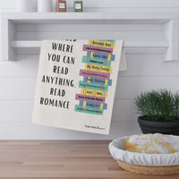 The towel is displayed by folding it over a towel bar underneath a shelf.