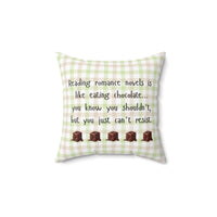 This 14-inch pillow features a white, light pink, and light green plaid background with black handwritten text that reads: "Reading romance novels is like eating chocolate… you know you shouldn’t, but you just can’t resist." Below the text, five illustrated chocolate pieces with a glossy, melting effect are lined up in a row. The overall design has a cozy, playful feel, combining a love for romance books with the indulgence of chocolate.