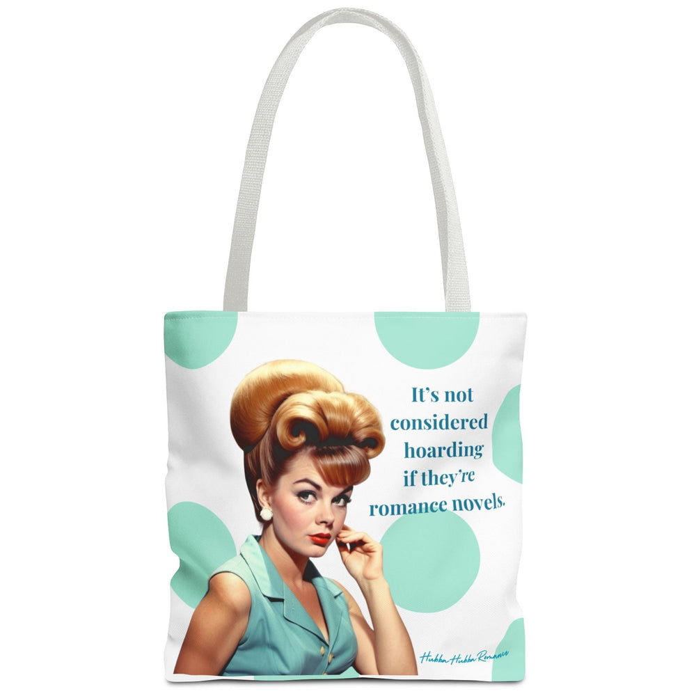 A white tote bag with white shoulder straps, featuring a retro-style illustration of a woman with a 1950s hairstyle, mint green polka dots background, and text that says it's not considered hoarding if they're romance novels.