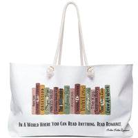 Image features a stylized row of romance book spines with playful titles including “Grumpy Single Dad,” “Surprise Baby,” “The Billionaire,” and more. Below the books is bold black text that reads: “In a world where you can read anything, read romance.” The design is colorful, cheeky, and celebratory of romance novels and their tropes. Displayed on a weekender bag, the artwork appeals to passionate readers who love their stories spicy, dramatic, and unapologetically feel-good.

