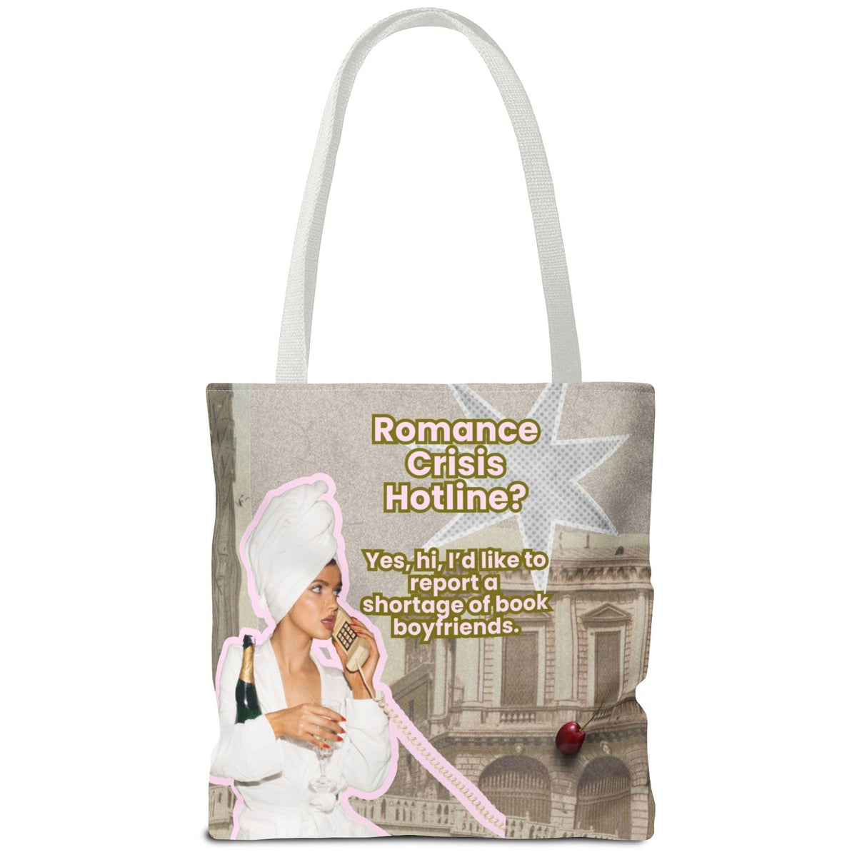A tote bag with white shoulder straps, featuring a printed graphic collage with the text 'Romance Crisis Hotline?' and an illustration of a woman in a white robe and towel, holding a bottle of champaign and talking on a phone next to a classical building. Totally silly but fun.