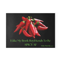 Glass cutting board with a black background featuring a pile of bright red chili peppers at the center. Below the image, lime green text reads: “I Like My Book Boyfriends To Be SPICY AF.” Made from durable, textured tempered glass with non-slip rubber feet, perfect for meal prep or as a bold kitchen accent. This is the smaller size.