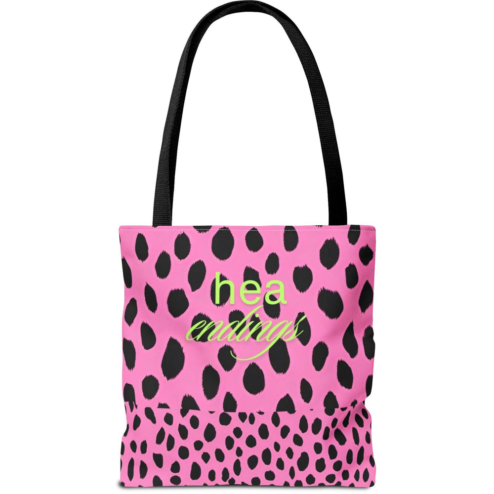 Image shows a pink background with bold, irregular black leopard spots. On one half of the image, the words “fictional heartbreaks” are written in light green cursive and block letters. Flipped upside down on the other half is the word “HEA” in matching green, also in mirrored script and block lettering. The design is playful and reversible, representing the highs and lows of romance reading. This double-sided tote is perfect for book lovers navigating love, loss, and happy endings.