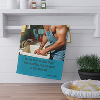The towel is displayed by folding it over a towel bar underneath a shelf.
