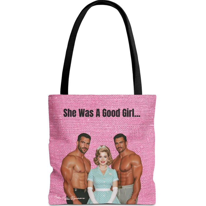Double-sided tote bag with hot pink background, retro blonde woman in polka dot dress with pearls and gloves, flanked by two shirtless men. Text reads: “She Was A Good Girl…”
