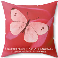A 20-inch pillow featuring a soft pink butterfly with delicate brown markings on its wings, set against a blurred close-up of a pink flower petal. The butterfly has a watercolor-like texture and a graceful appearance. Below the butterfly, pale pink uppercase text reads: "If butterflies had a language, they’d speak romance." The background is a warm, romantic shade of pink, creating a dreamy and whimsical aesthetic.