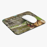Regency romance mouse pad featuring a handsome aristocratic man in period clothing before a castle with the text “I Like My Men Titled & Emotionally Repressed.” There is a white computer mouse on it.