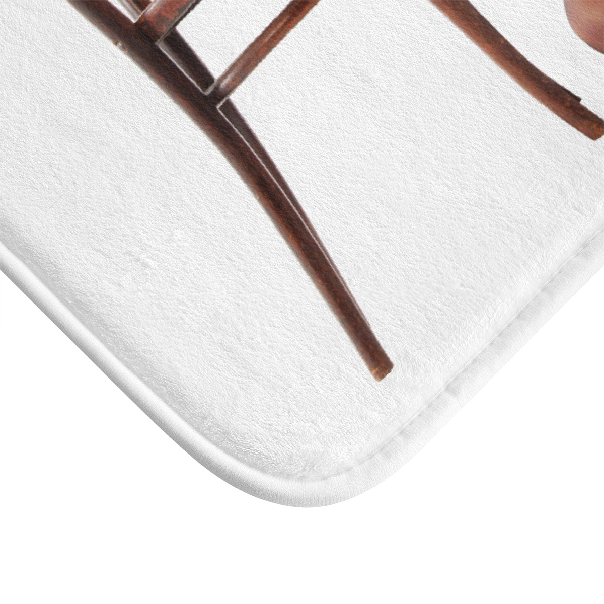 The corner of the mat is displayed to show the finished edges.