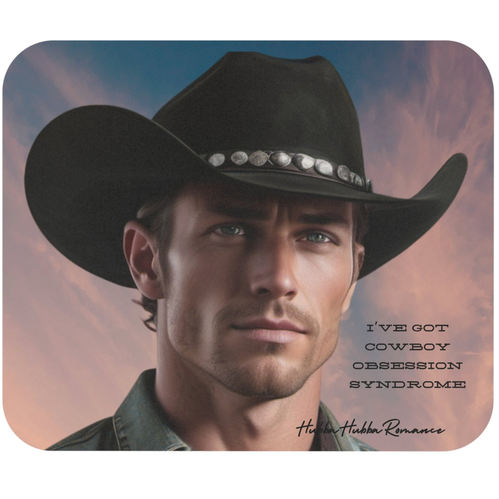 A digital art portrait of a handsome cowboy in a black hat and denim shirt, staring intently into the distance with a sunset background. Black text in a bold western font reads, “I’ve Got Cowboy Obsession Syndrome.” Ideal for romance fans and western decor lovers.