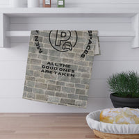 The towel is displayed by folding it over a towel bar underneath a shelf.
