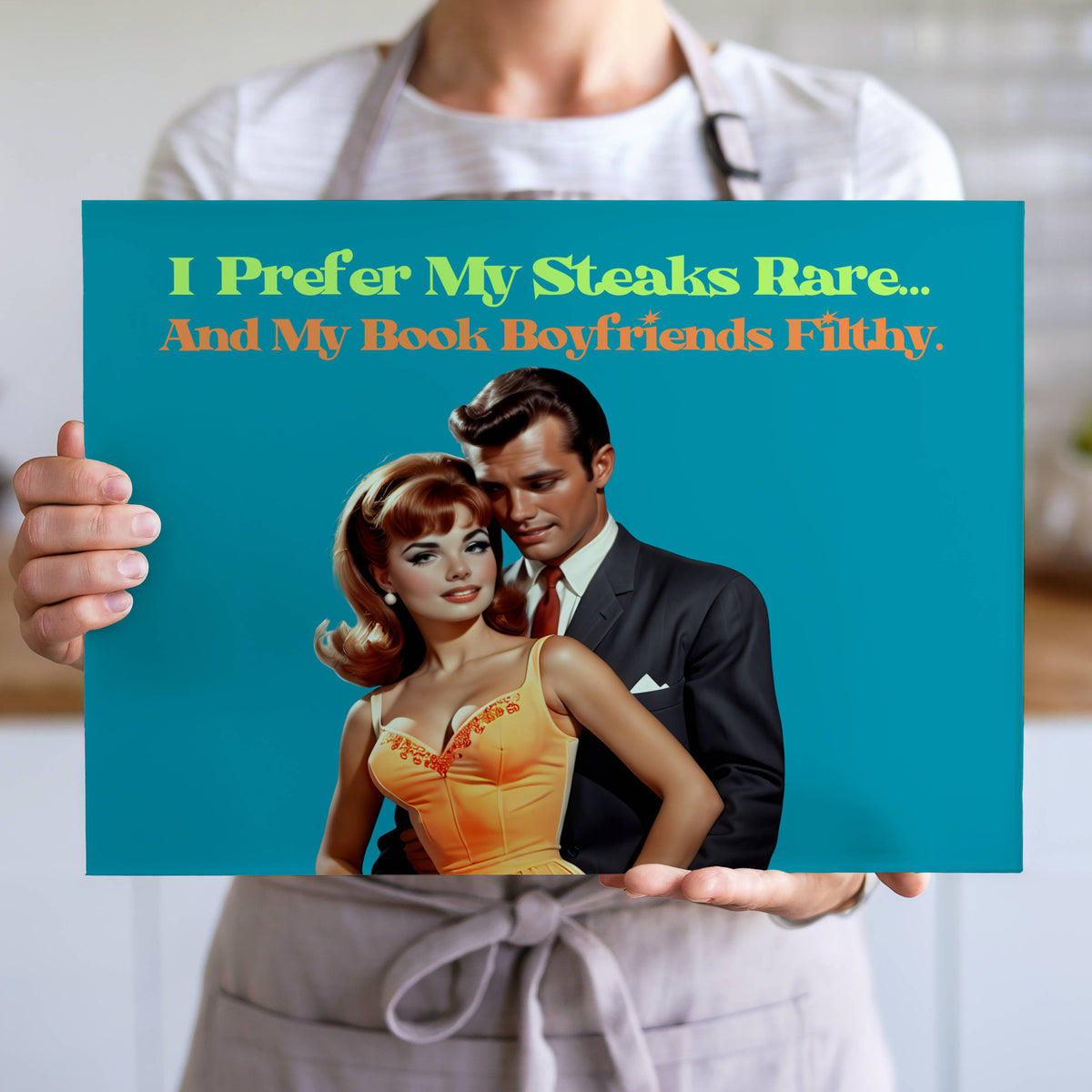 The cutting board is displayed upright in the hands of a cook to convey its size. This is the larger version.
