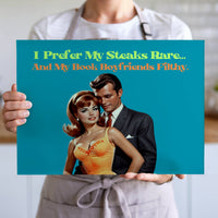 The cutting board is displayed upright in the hands of a cook to convey its size. This is the larger version.