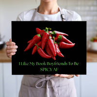 The cutting board is displayed upright in the hands of a cook to convey its size. This is the larger version.