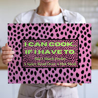 The cutting board is displayed upright in the hands of a cook to convey its size. This is the larger version.