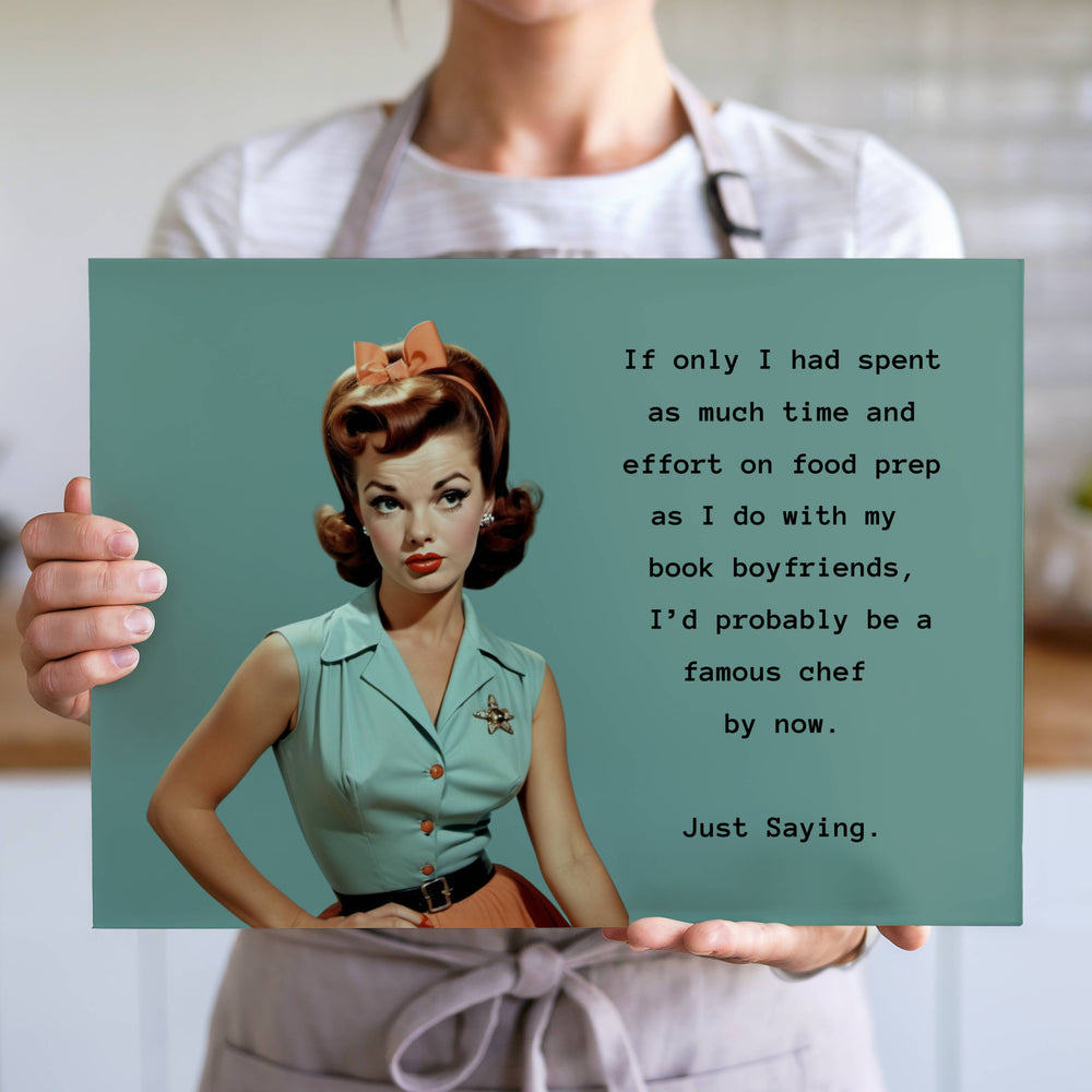 The cutting board is displayed upright in the hands of a cook to convey its size. 