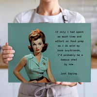 The cutting board is displayed upright in the hands of a cook to convey its size. This is the larger version.