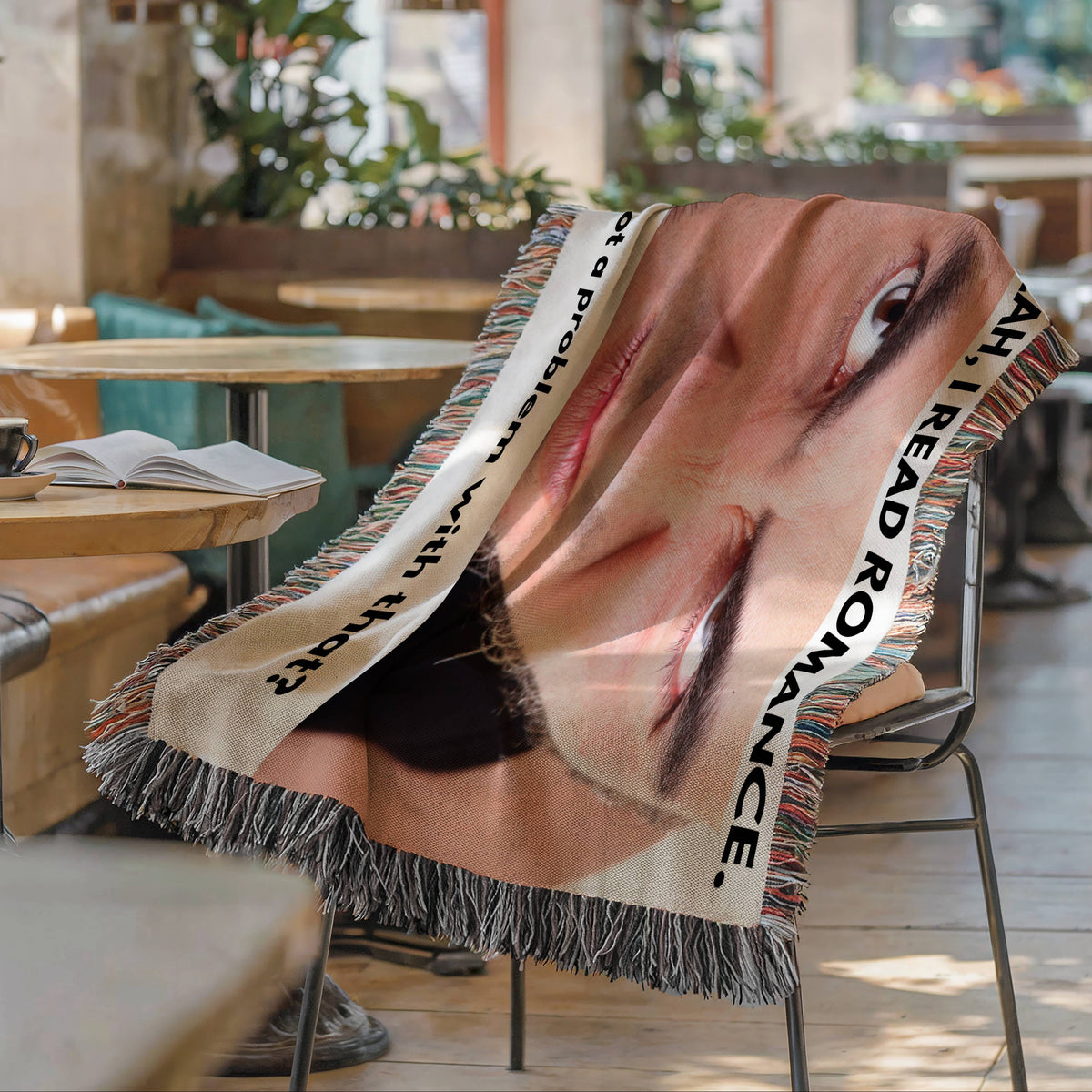 Funny romance reader woven blanket draped over a chair featuring an intense staring face and bold reading quote.