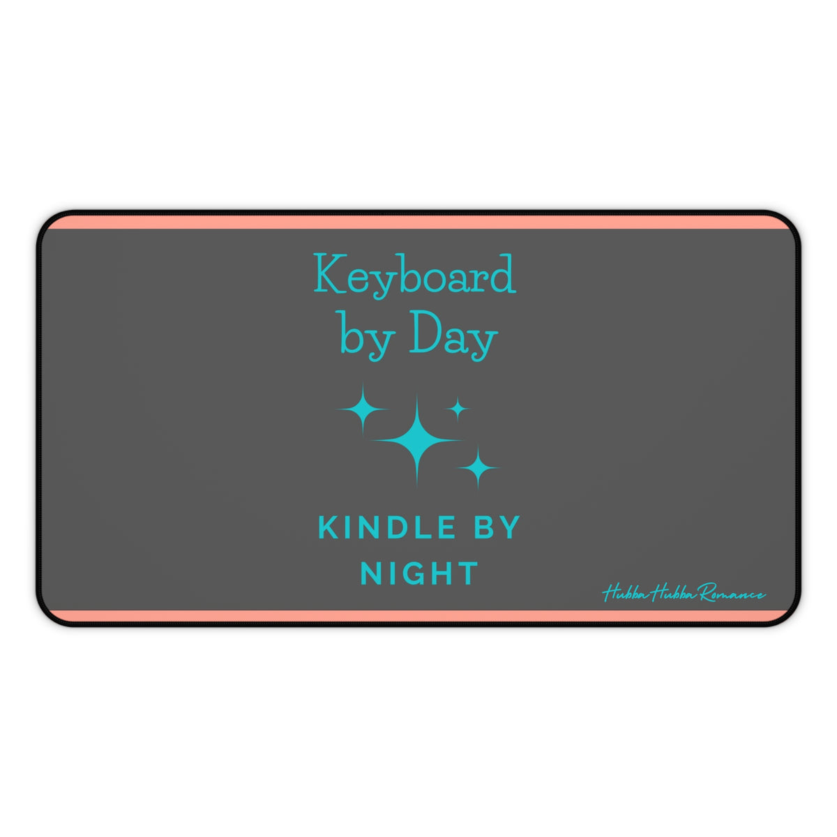A charcoal gray desk mat features a playful message split across two lines: "Keyboard by Day" in turquoise serif text on the left, and "Kindle by Night" in sans-serif turquoise on the right. Turquoise starburst-style sparkles accent the design, and two thin orange horizontal lines run along the top and bottom edges. This is the medium version.