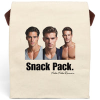 A plain canvas lunch bag features three handsome, muscular men standing side by side—styled like classic romance novel heartthrobs. One wears a snug gray T-shirt, one a blazer over a T-shirt, and the third is shirtless, showing off his sculpted chest. Beneath them, large bold text reads “Snack Pack,” cheekily implying these book boyfriends are today’s midday indulgence. The bag has a fold-over top, secure Velcro closure, and a sturdy handle for easy carrying. 