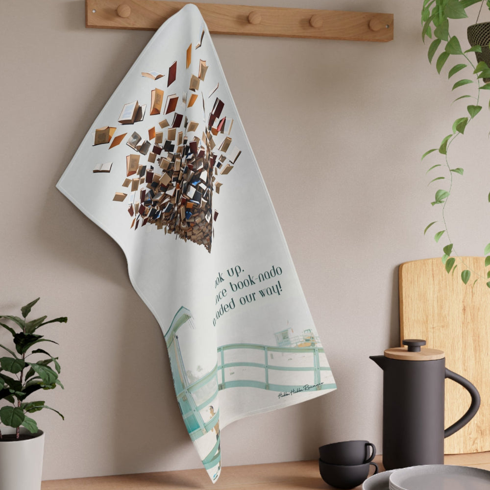 The towel is displayed on a wall hook in a kitchen setting.

