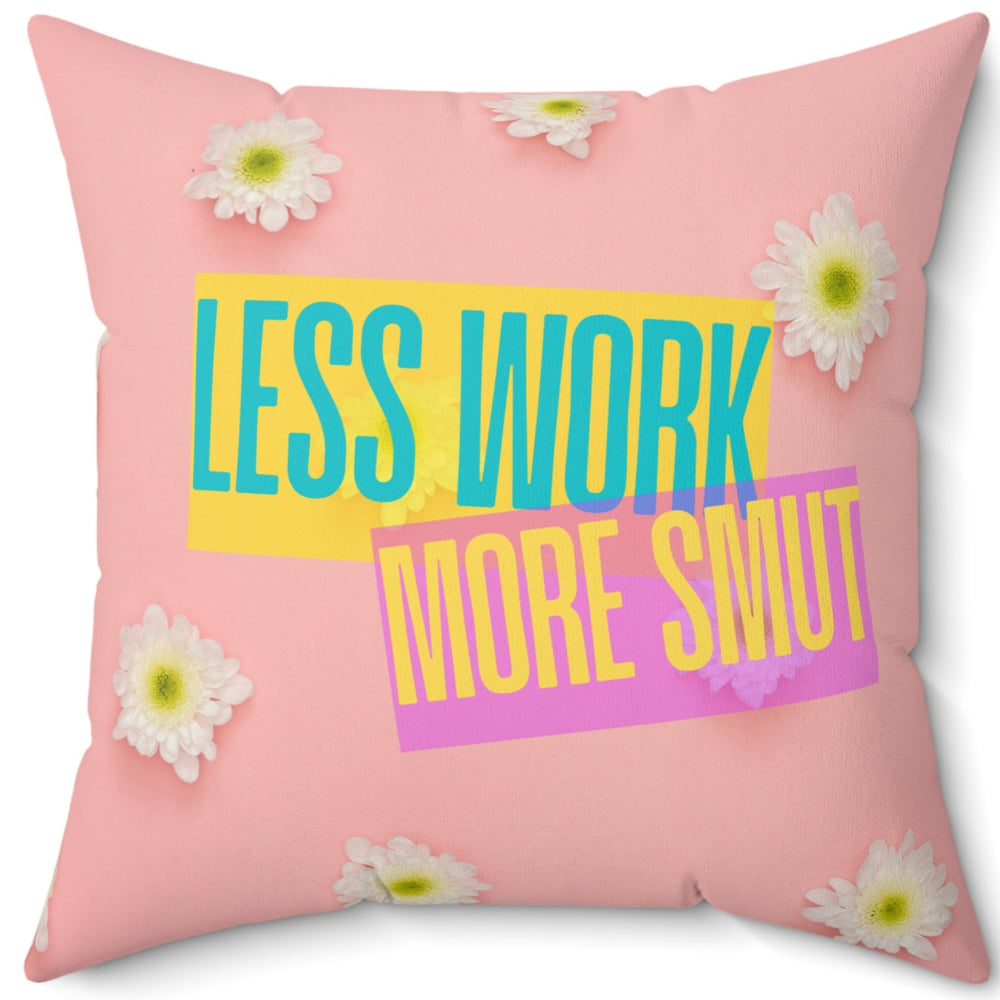 A 20-inch pillow featuring a pastel pink background scattered with fresh white daisies. Bold, colorful text overlays the center, reading "LESS WORK" in bright teal on a yellow background and "MORE SMUT" in hot pink on a purple background. The playful, modern typography and vibrant color contrast give the design a fun, sassy, and energetic vibe, perfect for romance readers who prioritize their book boyfriends over their to-do lists.