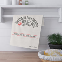 The towel is displayed by folding it over a towel bar underneath a shelf.