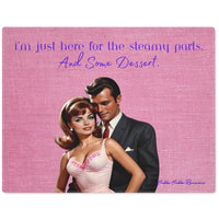 The image showcases a vintage-styled illustration of a glamorous couple. The man, dressed in a formal black suit, stands closely behind the woman, who is wearing a pink dress with floral embroidery. Both characters are portrayed with a classic 1960s aesthetic. The background is textured pink, and overlay text in purple cursive reads, "i'm just here for the steamy parts. And Some Dessert." The image blends romance with a touch of humor, appealing to fans of retro chic and playful banter.