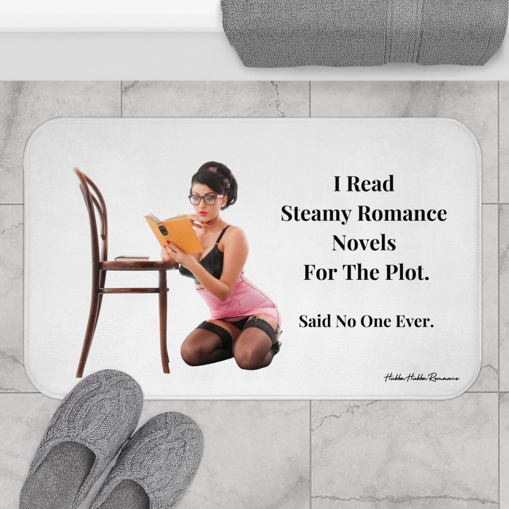 The bath mat is displayed next to a tub with a pair of gray knit slippers.

