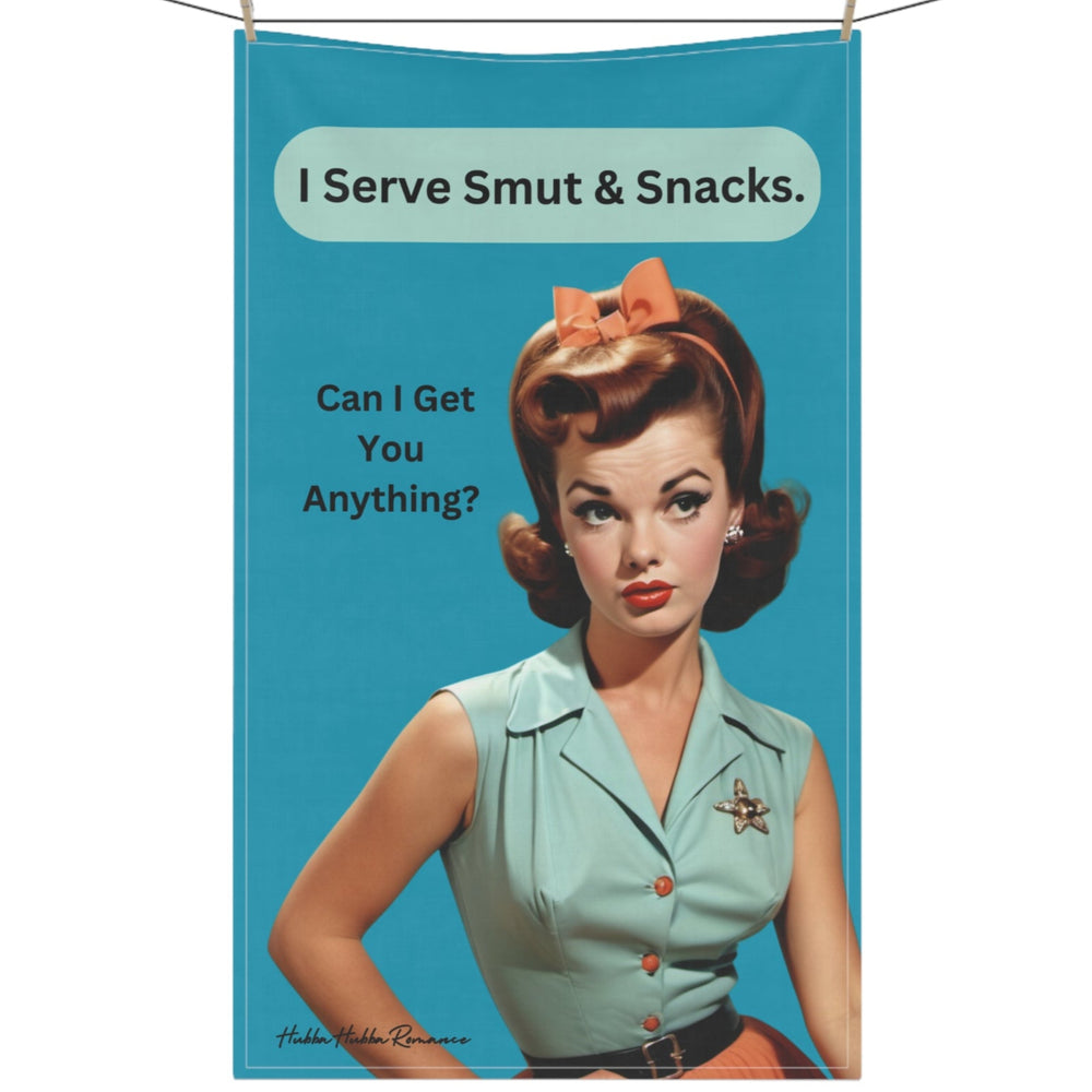 This kitchen towel features a retro image of a woman with bouffant hair and an orange bow, dressed in a teal blouse, orange skirt and black belt with a starfish pin on her shoulder. She has a sassy smirk on her face. She is paired with text that reads "I Serve Smut and Snacks. Anything For You?" in a playful font against a teal background. This design merges retro fashion with a humorous, bold statement, ideal for conveying a cheeky and inviting atmosphere. The towel is displayed hanging on a clothesline.