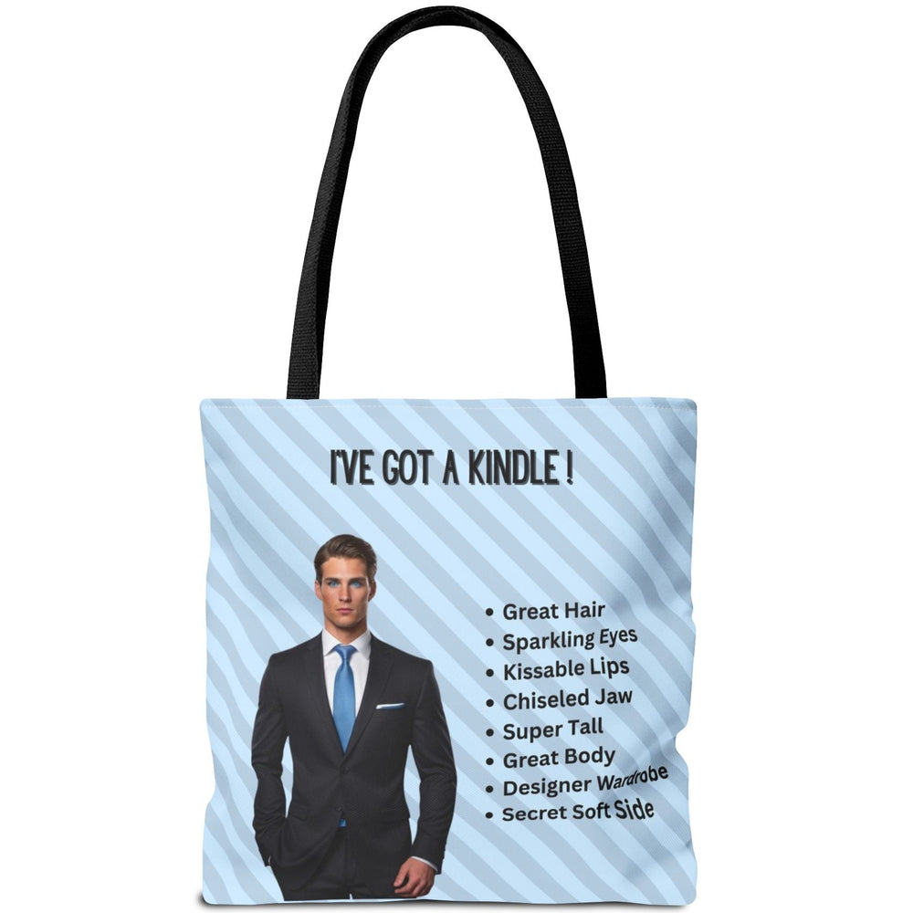 The text above him reads “I've  Got A Kindle.” A checklist beside him includes: Great Hair, Sparkling Eyes, Kissable Lips, Chiseled Jaw, Super Tall, Great Body, Designer Wardrobe, and Secret Soft Side. This is one side of a two-sided tote designed for readers who love the billionaire trope.