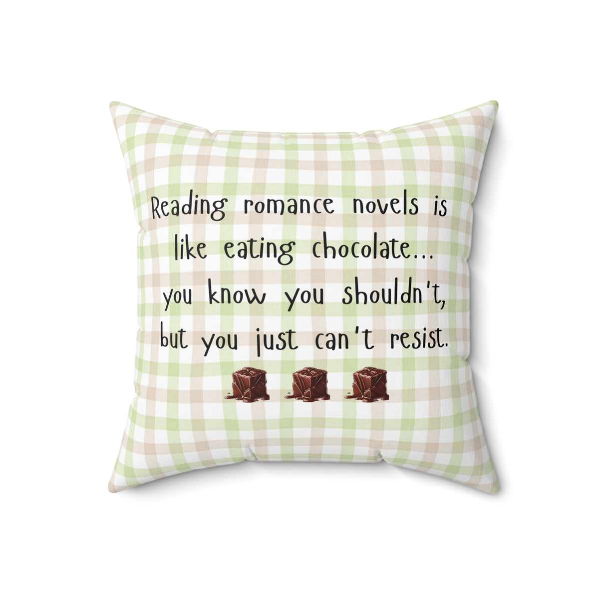 Square pillow with a beige , pink and green plaid background. Black playful text says: “Reading romance novels is like eating chocolate… you know you shouldn’t, but you just can’t resist.” Three illustrated chocolate pieces sit along the bottom. A cheeky decorative pillow for romance readers.